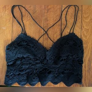 Free people lace bra top with adjustable straps. Elastic back. Size varies.